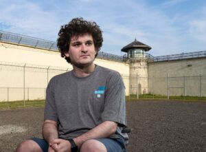 PHOTO Sam Bankman-Fried Sitting Out In The Prison Yard