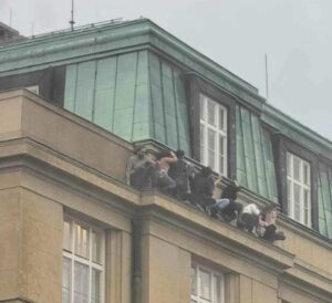 PHOTO Citizens Hanging On For Dear Life From Balcony During Prague Mass Shooting