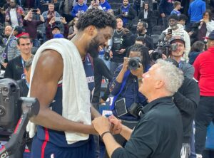 PHOTO Joel Embiid Celebrating 70 Point Performance With Brett Brown