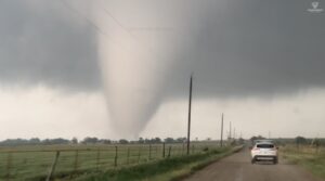 PHOTO Car Driving On The Road Right Next To Tornado In Winthorst Texas