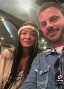 PHOTO Mica Miller Wearing Flowers On Her Head Looking Somewhat Happy