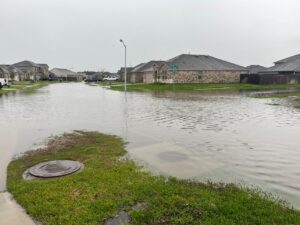 PHOTO Million Dollar Neighborhood In Houston TX Has Floodwaters Up To The Stop Sign
