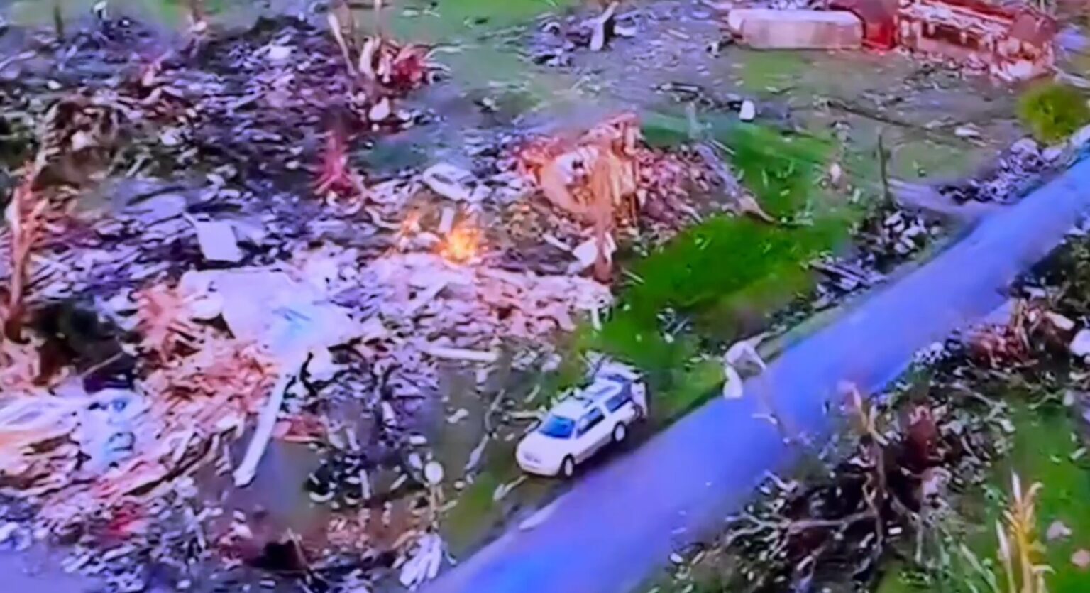 PHOTO People's Cars Parked Outside Destroyed Homes In Barnsdall