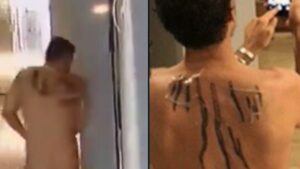 PHOTO Proof Hunter Biden's Back Tattoo Matches Dude Dragging Woman Down Hallway