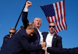 PHOTO Donald Trump Raising His Fist While Covered In Blood