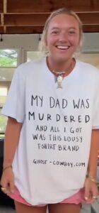 PHOTO Eva Benefield Smiling While Wearing Shirt That Says My Dad Was Murdered And All I Got Was This Lousy T-Shirt Brand