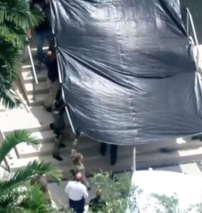 PHOTO FBI Covered Sergio Pino's Body With A Tarp While Hauling It Out The Front Entrance