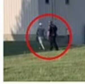 PHOTO Of Thomas Crooks Walking Side By Side With Police Officer As He Made His Way To Building Where He Opened Fire On Trump