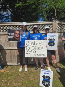PHOTO Protesters Holding Justice For John O'Keefe Signs