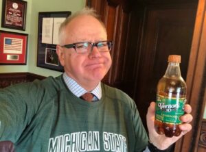 PHOTO Tim Walz Drinking Beer Out Of A Bottle While Wearing A Michigan State Shirt