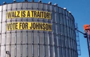 PHOTO Tim Walz Is A Traitor Sign On Water Tank In Minnesota