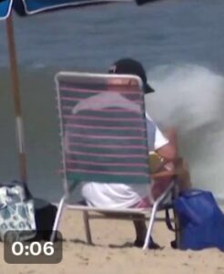 PHOTO Joe Biden Sitting On The Beach With An Umbrella Over Him While Georgia School Shooting Was Happening