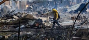 PHOTO Firefighters Digging Through Burnt Rubble Ventura County From Mountain Fire