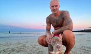 PHOTO Janis Timma On The Beach With His Dog