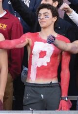 PHOTO Luigi Mangione At Football Game Shirtless Wearing Red Face Paint