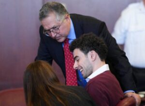 PHOTO Luigi Mangione Smug Smile While Talking To His Lawyer