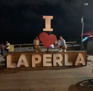 PHOTO Luigi Mangione Taking Picture With His Boyfriend In Front Of I Love Laperla Sign