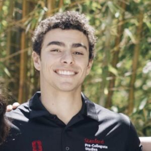 PHOTO Luigi Mangione Wearing A Stanford Pre-College Studies Polo Shirt