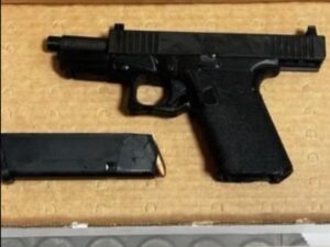 PHOTO Police Recovered Firearm With Suppressor And New Jersey Driver's License When Arresting Luigi Mangione