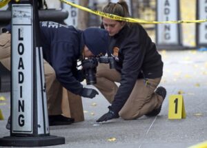 PHOTO Police Setting Up Crime Scene Where Brian Thompson Was Shot