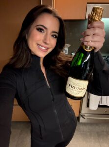 PHOTO Ashley St Clair Looking Like A Hot Jew With Trump Bottle Of Wine In All Black Workout Jacket And Leggings