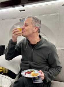 PHOTO Marc Fogel Drinking Beer And Eating Dinner On Board A Jet Back To The United States