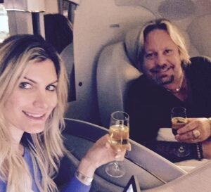 PHOTO Vince Neil Drinking Wine On Private Jet With His Girlfriend