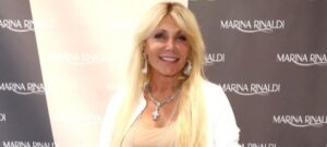 PHOTO Pamela Bach Wearing Cross Necklace Around Her Neck