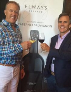 PHOTO Jeff Sperbeck Clanging Elway Wine With His Buddy John Elway