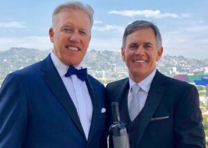 PHOTO Jeff Sperbeck Holding Very Expensive Bottle Of Champagne With John Elway