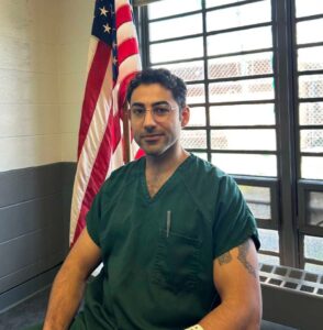 PHOTO Mohsen Mahdawi In Prison Jumpsuit