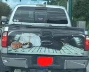 PHOTO Pickup Driving Around With Decal On Bed Of Vehicle With Joe Biden Tied Up By Rope