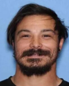 PHOTO Travis Decker Smirking In His Previous Mugshot