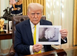 PHOTO Donald Trump Holding Up Wess Roley's Dads Tatted Nuckles Meme