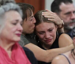 PHOTO Dylan Mortensen Getting A Hug While Crying After Speaking Ay The Bryan Kohberger Sentencing