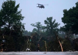 PHOTO Helicopter Hoovering Over Kerrville Texas Looking For Floodwater Survivors