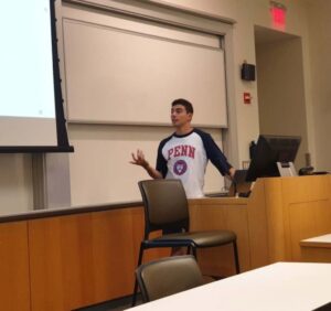 PHOTO Luigi Mangione Wearing UPenn Ivy League Shirt While Giving Lecture In Classroom