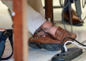 PHOTO Luigi Mangione's Cuffed Feet While Wearing Dress Shoes In Court