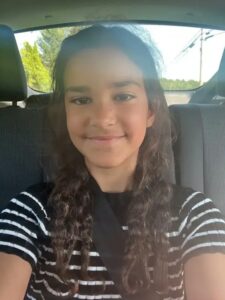 PHOTO Of Missing 9 Year Old Canadian Melina Frattolin In Back Seat Of Car