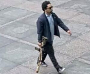 PHOTO Shane Tamura Casually Walking Into Building With Lethal Loaded Gun