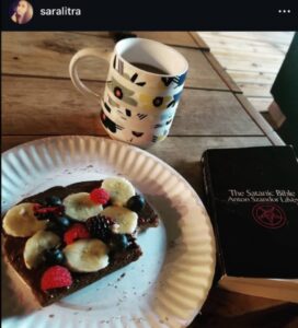 PHOTO Wess Roley Reading The Satanic Bible While Eating Fruit Cake For Breakfast