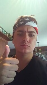PHOTO Ethan Nieneker Wearing American Flag Bandana Giving Thumbs Up Like Lunatic