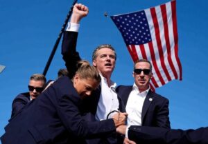 PHOTO Gavin Newsom Fist Pumping Like Trump Surrounded By Secret Service Meme