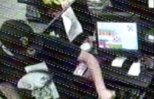 PHOTO Of Austin Robert Drummond Pointing Gun At Clerk To Rob Store