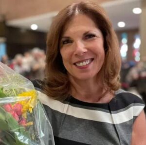 PHOTO Of Robin Westman's Mother Holding Flowers