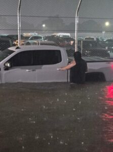 PHOTO People Getting On Public Transportation In Milwaukee And Getting In Their Cars Have Floodwaters Up To Their Chests