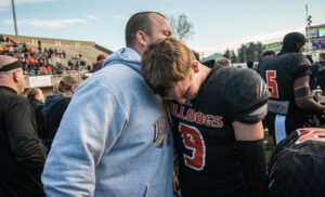 PHOTO Tyson Bagent's Right Hand Man Hugging Him On The Field After Football Game