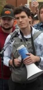 PHOTO Charlie Kirk Shooter Debating Charlie Face To Face While Holding Megaphone