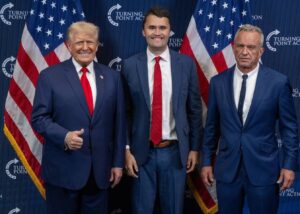 PHOTO Charlie Kirk Standing With Donald Trump And RFK Jr At Turning Point USA