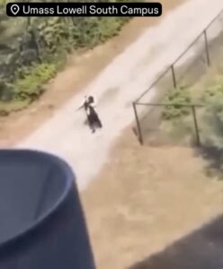 PHOTO Dude Clearing Pointing Loaded Gun On UMass Lowell South Campus